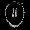 Silver floral jewelry necklace earrings set featuring a silver-toned crystal necklace with intricate floral design and matching drop earrings