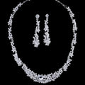 Silver-toned crystal silver floral jewelry necklace earrings set with intricate floral design and matching dangling earrings