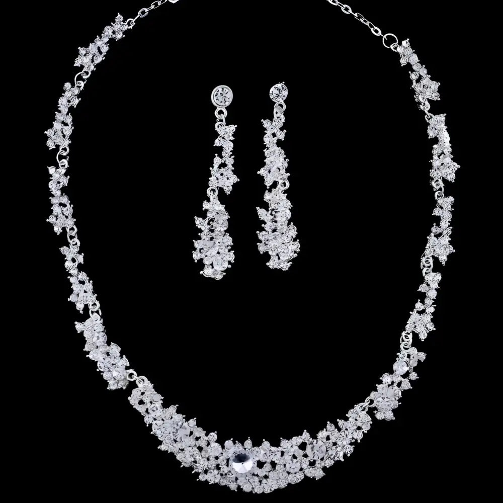 Silver-toned crystal silver floral jewelry necklace earrings set with intricate floral design and matching dangling earrings