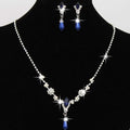 Silver floral personality dropspearl necklace set with sparkling crystals and blue teardrop pendants and matching earrings