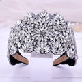 A fashion retro headband featuring a sparkling silver rhinestone floral design on a black velvet base