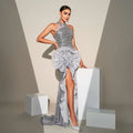 Silver floral shimmering silver banquet sequined sheath dress with a dramatic ruffled floral accent at the hip
