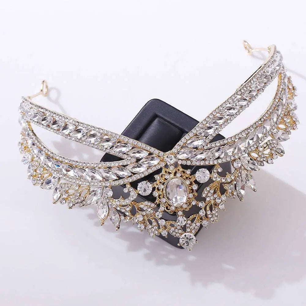 A gold-toned wedding crown headdress with silver floral details and clear oval crystal accents for weddings