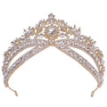 A gold-toned wedding crown headdress with silver floral design and oval clear crystals for bridal wear