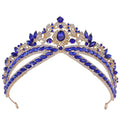 Silver floral wedding crown headdress with oval crystal featuring royal blue and gold tiara with sapphires and leaf motifs