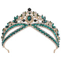A sparkling gold wedding crown headdress with silver floral design and oval crystal rhinestones in an elegant leaf pattern