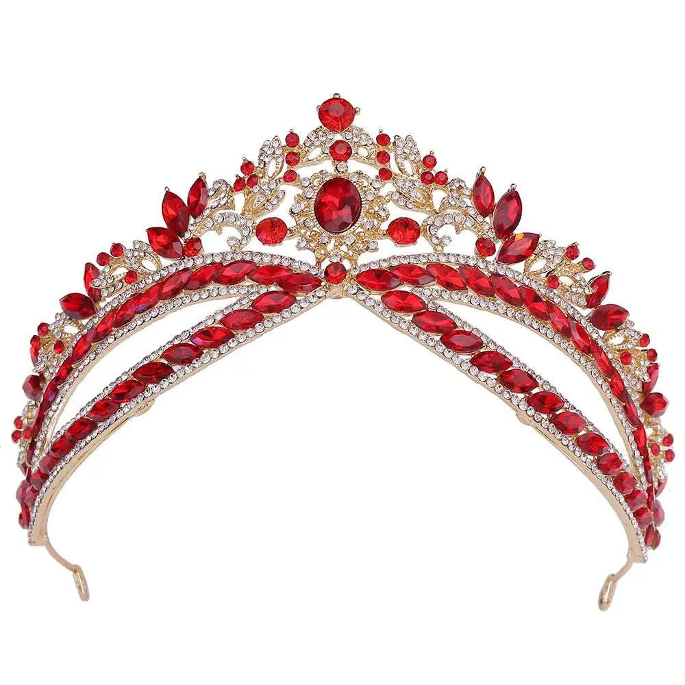 A glamorous gold wedding crown headdress with silver floral design and oval crystal accents featuring vibrant red and clear crystals