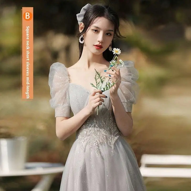 A silver gray tulle beaded sisters dress female featuring a delicate lace gown with puffy short sleeves and square neckline