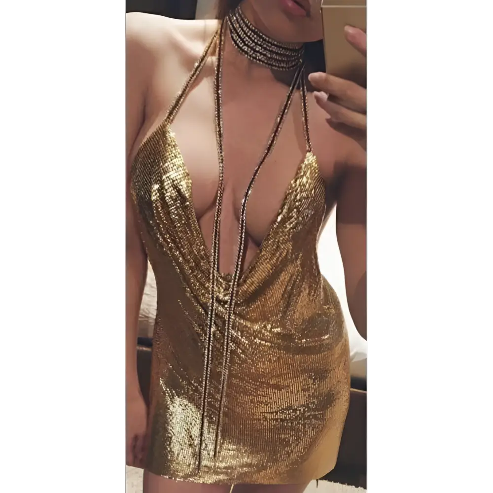Silver ladies sequined party dress in shimmering gold with deep plunging neckline and draped front detail