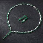 Emerald and white crystal tennis necklace set with silver-toned clasp paired with silver leaf cubic zirconia bride wedding earrings