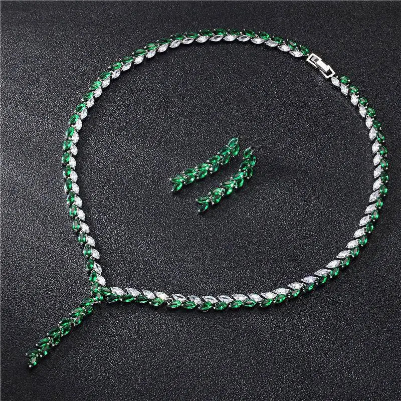 Emerald and white crystal tennis necklace set with silver-toned clasp paired with silver leaf cubic zirconia bride wedding earrings
