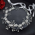 Silver leaf pearl bridal hair band adorned with rhinestone alloy crystals and delicate pearls for elegant wear