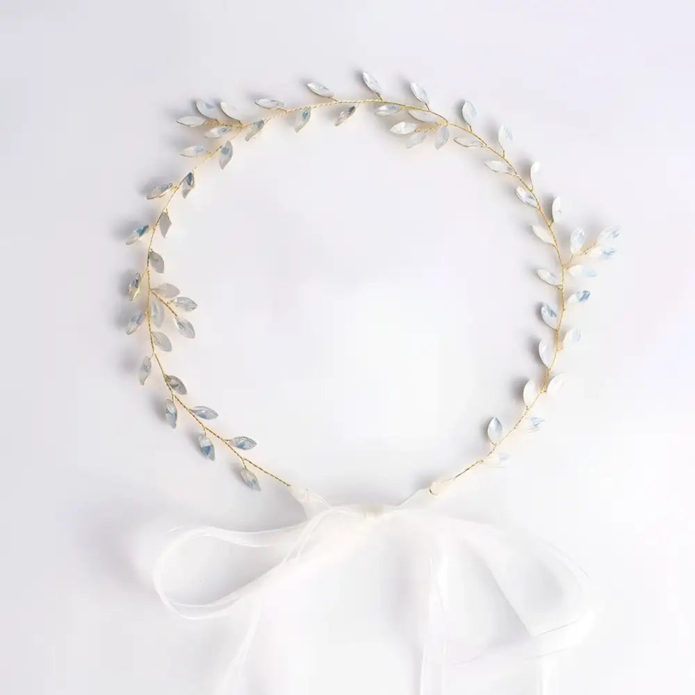 Elegant silver leaf protein rhinestone headdress hair band with delicate gold wire stems and soft white organza bow