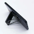 Black magnetic phone stand holding smartphone upright with sleek minimalist design silver magnetic bracket mobile phone holder
