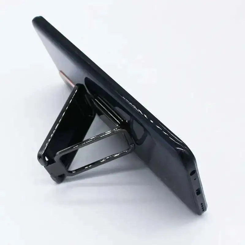 Black magnetic phone stand holding smartphone upright with sleek minimalist design silver magnetic bracket mobile phone holder