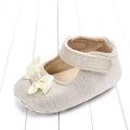 Beige woven fabric baby shoe with cream satin bow, a matching satin detail in silver mesh princess shoes bow for babies