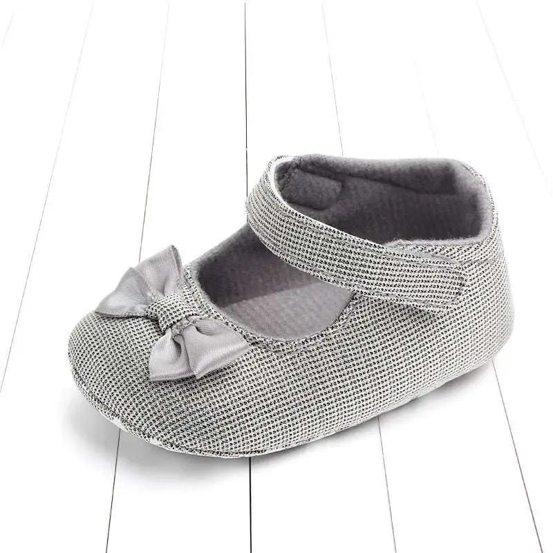 Silver mesh princess shoes bow for babies featuring a matching satin bow on the toe in an elegant design