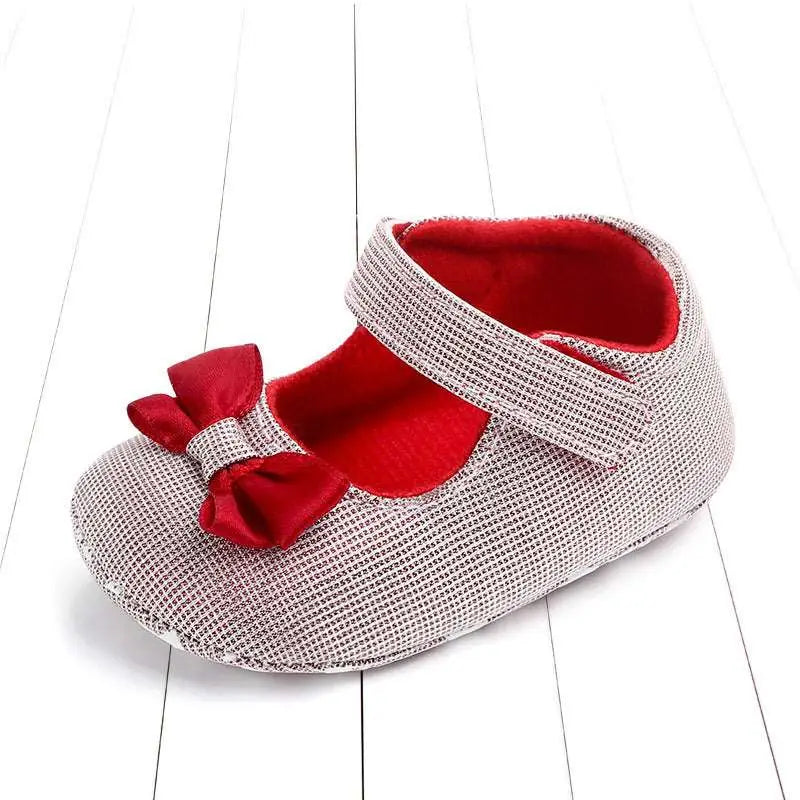 Silver mesh princess shoes bow for babies featuring a red satin bow and matching satin interior lining
