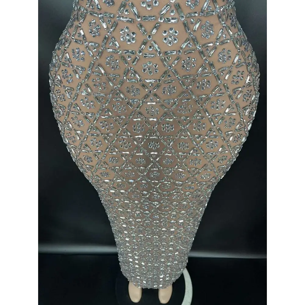 A silver metallic niche princess gathering banquet dress featuring a shimmering form-fitting gown with intricate beading and sequins