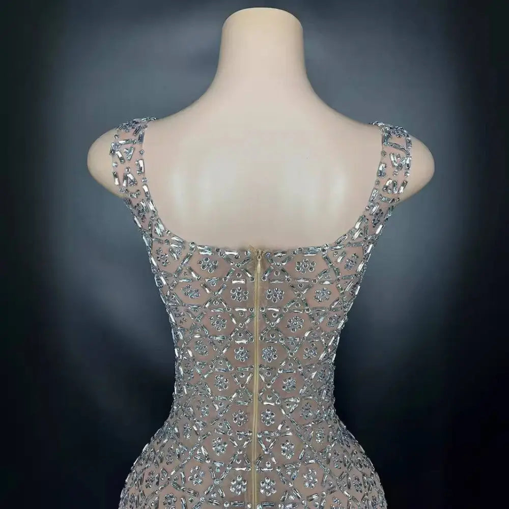 A silver metallic niche princess gathering banquet dress with shimmering silver beads and a sheer mesh overlay with geometric patterns
