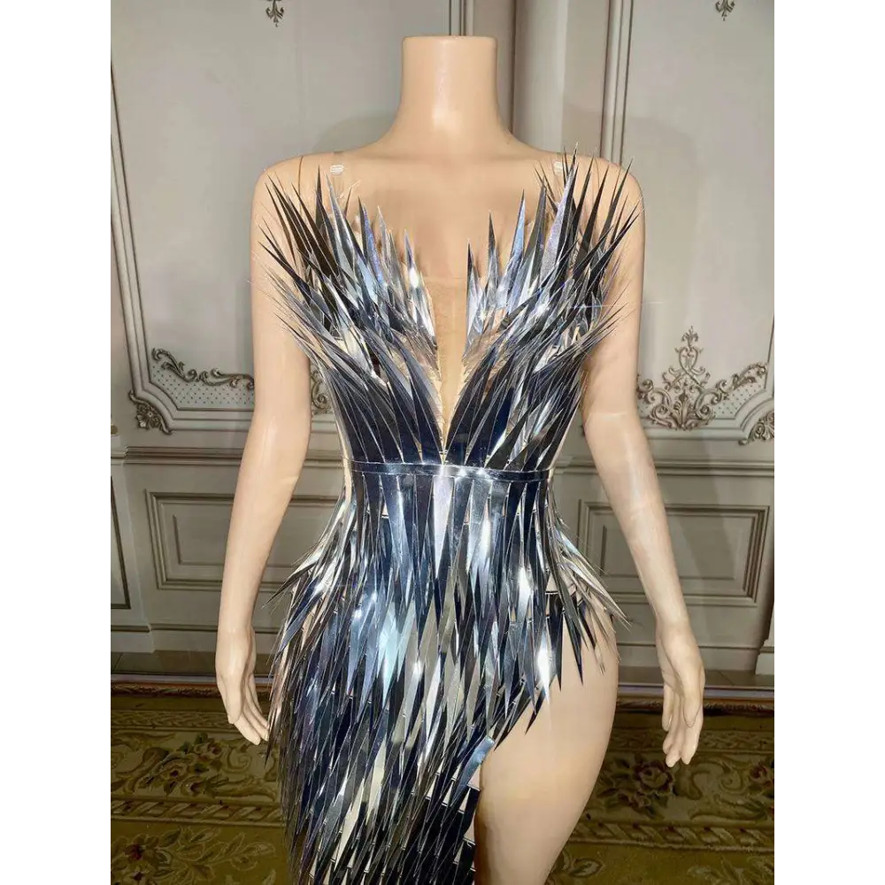 Silver metallic sequined luxury evening dress with shimmering feather-like texture, plunging v-neckline, and high slit for stage advanced light use