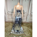 A silver metallic sequined luxury evening dress with fitted bodice and layered fringe for stage advanced light events