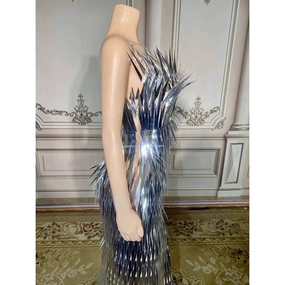 Silver metallic sequined luxury evening dress with dramatic spiky design cascading from shoulder to hem for stage advanced light use