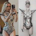 Shiny silver mirrored mosaic one-piece performance bodysuit with geometric tile design and black trim for bikini performance hall