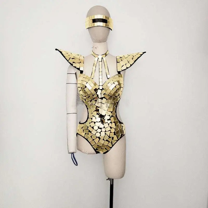 Silver mirror performance bodysuit featuring a shimmering gold mosaic design with reflective geometric tiles and black trim accents