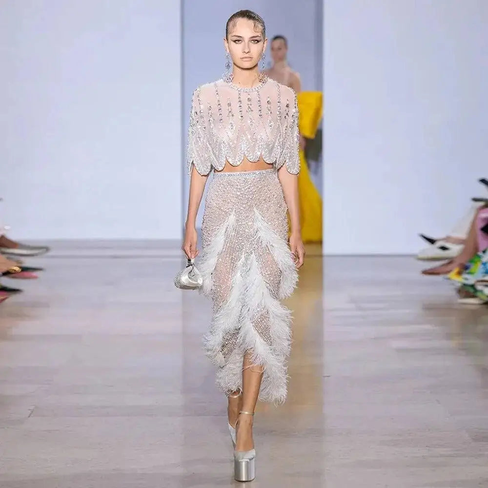 Silver nude feathered mini skirt with sheer embellished beaded overlay and scalloped hemline for evening wear