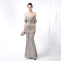 Silver off-the-shoulder sequined long dress with fitted bodice and shimmering fabric for elegant evening wear