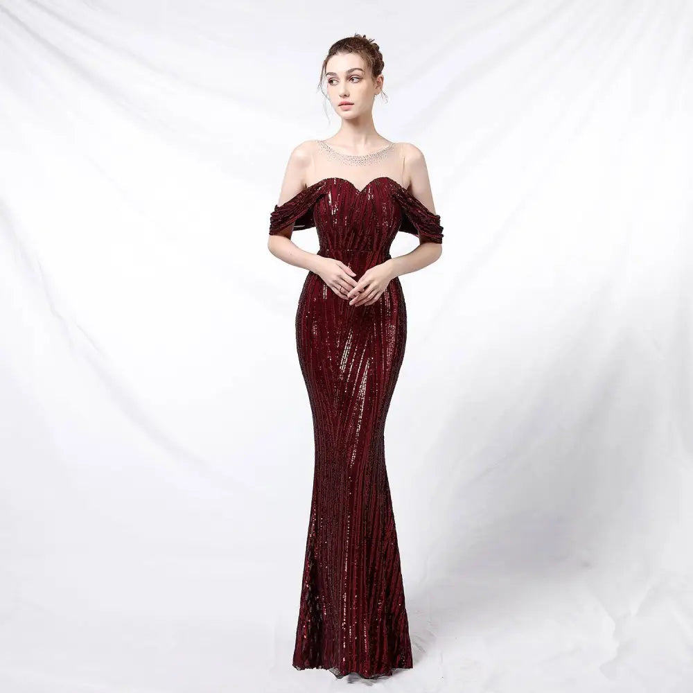 Silver off-the-shoulder sequined long dress in shimmering burgundy with fitted bodice and flowing mermaid skirt