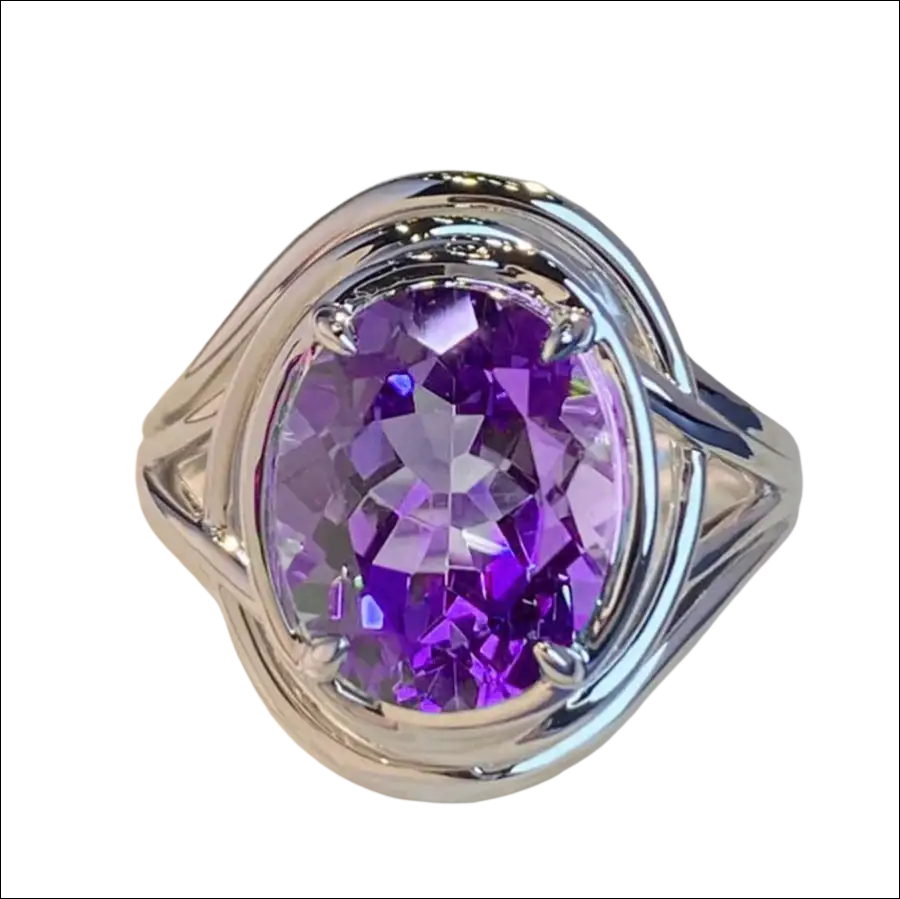 Silver oval amethyst ring with a large purple stone and an intricate braided silver band, perfect as a fashion amethyst ring