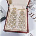 Elegant gold-toned chandelier earrings with silver pearl micro inlay zircon and zircon style beaded fringe details