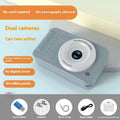 Silver portable ccd digital kids camera in gray plastic with dual circular lenses for student use