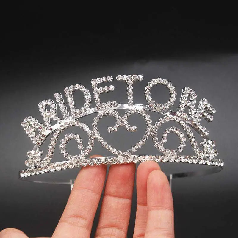 A sparkling silver rhinestone bridal headband with intricate heart-shaped designs for luxury women’s fashion