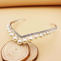 A delicate silver wedding crown alloy tiara with sparkling rhinestones and lustrous white pearls