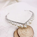 Silver rhinestone and wedding crown alloy headband featuring lustrous white pearls and sparkling rhinestones in a v-shaped design