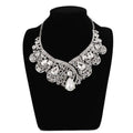 A silver rhinestone korean super alloy jewelry set featuring a sparkling statement necklace with filigree and teardrop crystals