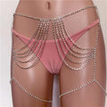 Silver rhinestone waist chain jewelry glistening over pink lingerie as a shimmering rhinestone waist chain body harness