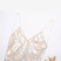 A delicate sheer camisole printed underwear dress with thin straps and shimmering silver metal foil printed tie-dye pattern