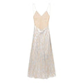 A flowing floor-length printed underwear dress with a beige satin bodice and shimmering silver metal foil printed lace skirt