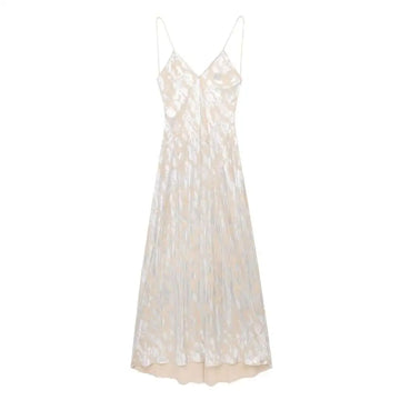 A shimmering silver metal foil printed underwear dress in ivory satin with delicate spaghetti straps and subtle texture