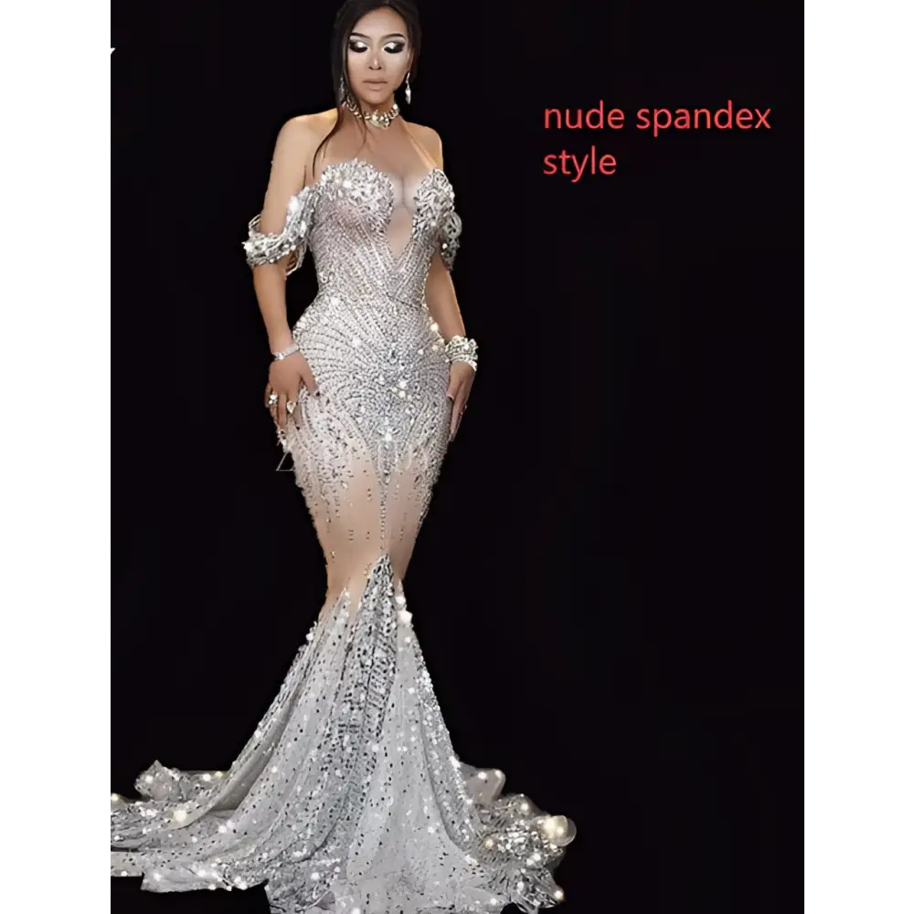 A shimmering silver female singer gown with intricate beading, off the shoulder sleeves, perfect for nightclub dj female use