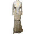 A shimmering champagne-colored backless tight fishtail gown with intricate white lace and silver beading detailing
