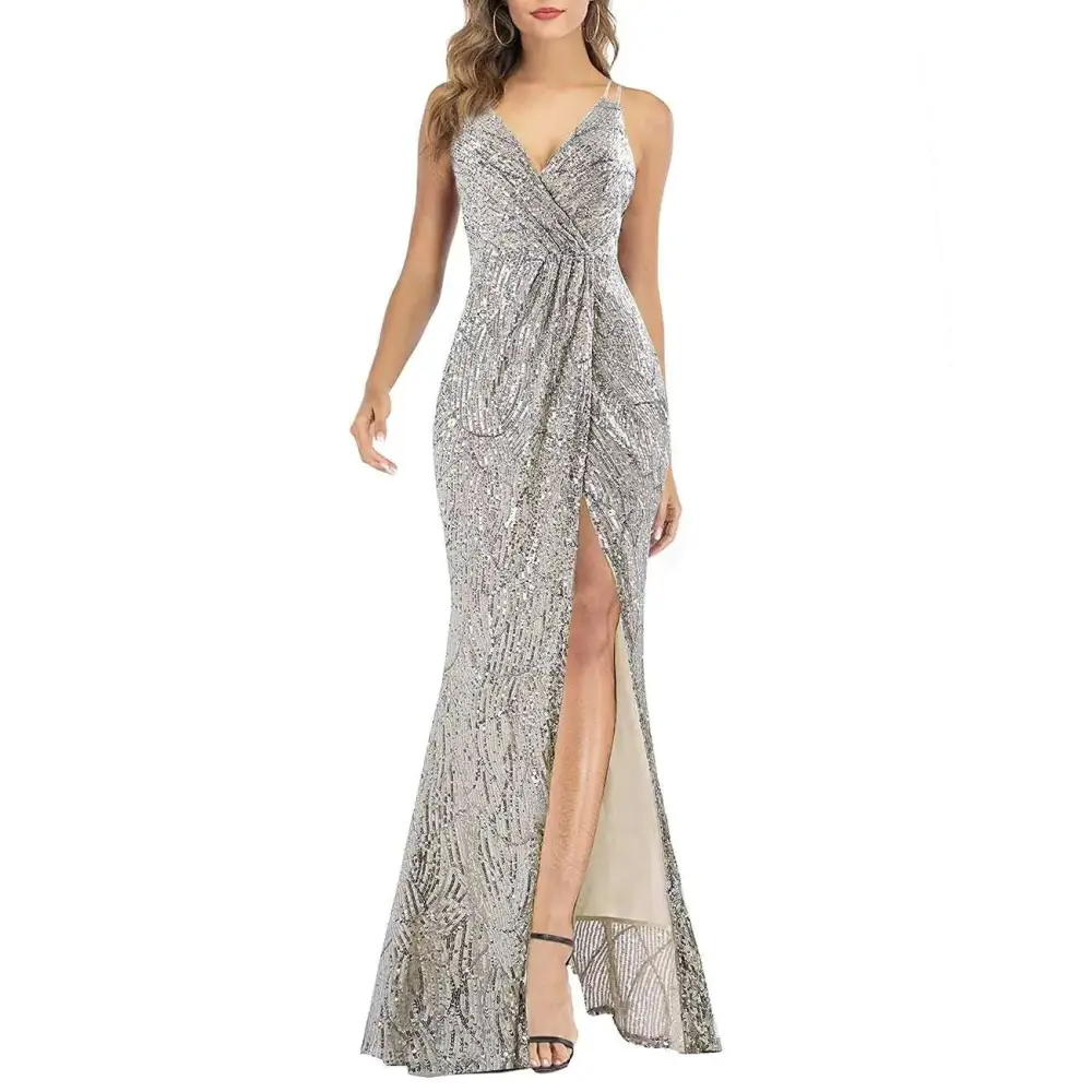 A silver sequined ladies maxi long sexy party dress with a deep v-neckline and a high slit
