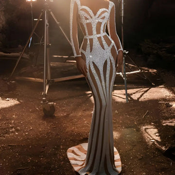 Silver sequined sprinkled gold banquet evening dress featuring a form-fitting gown with long sleeves and geometric cutouts