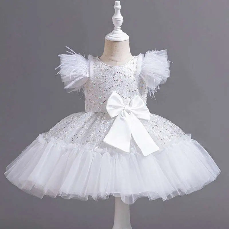White sequined wedding dress tulle skirt with feathered sleeves and large satin bow at the waist for summer weddings