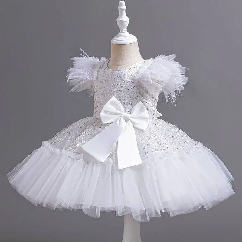 Silver sequined wedding dress tulle skirt with white sequined tutu, feathered shoulders, and satin bow at the waist
