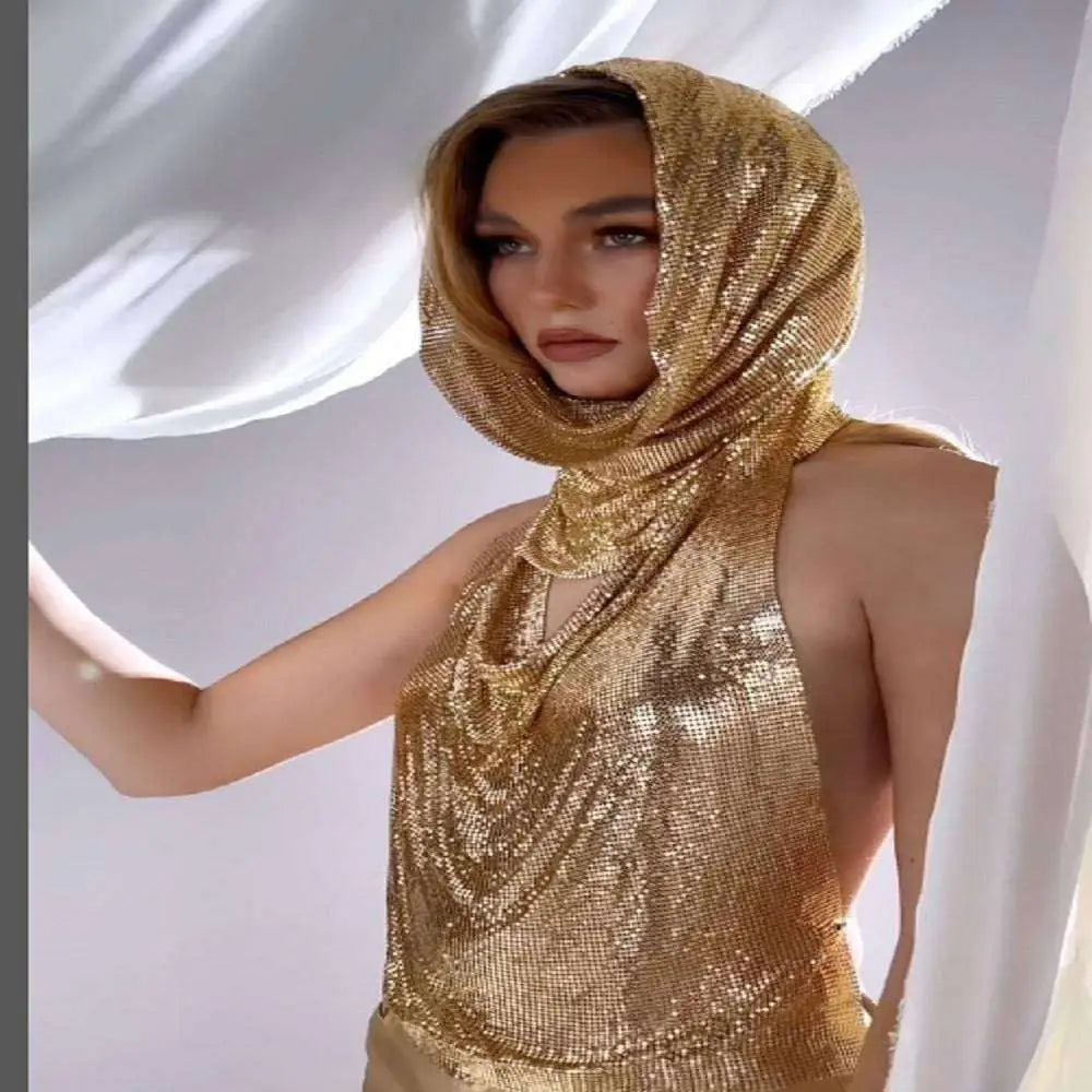 A shimmering gold mesh headscarf and top set made of slit metal sequins fabric draped elegantly over the shoulders